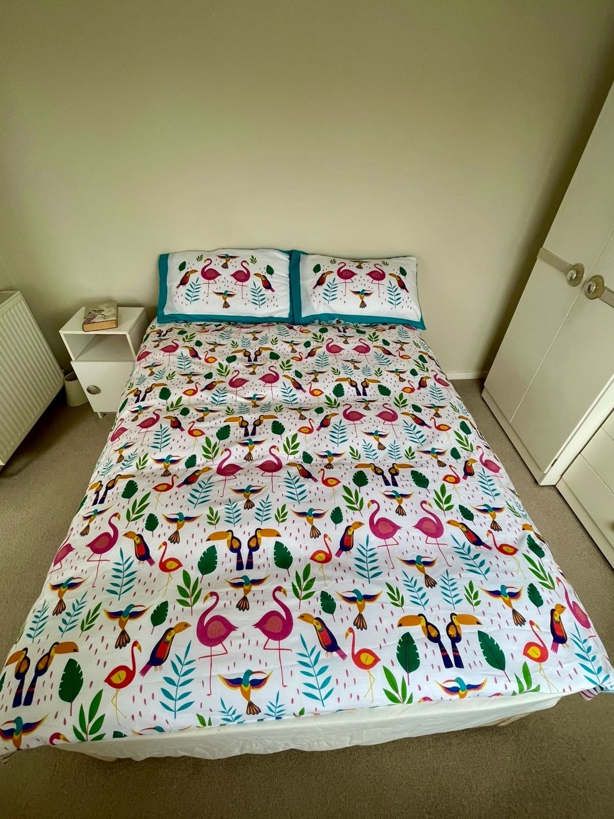 The queen bedroom, made up in tropical linen