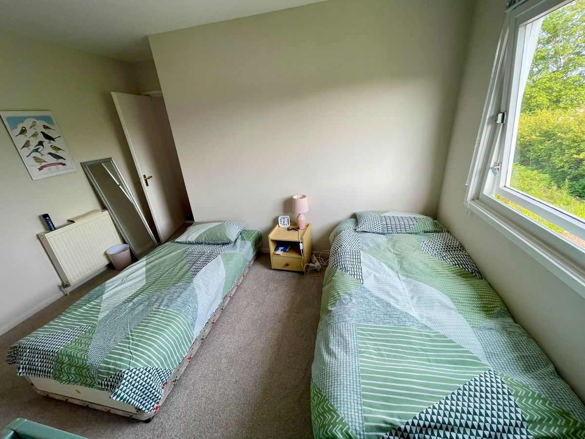 The twin bedroom, looking out to the trees